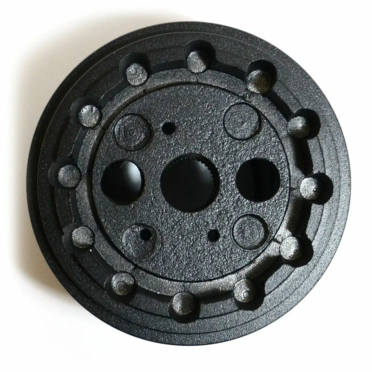 Black metal gear or pulley on a white background