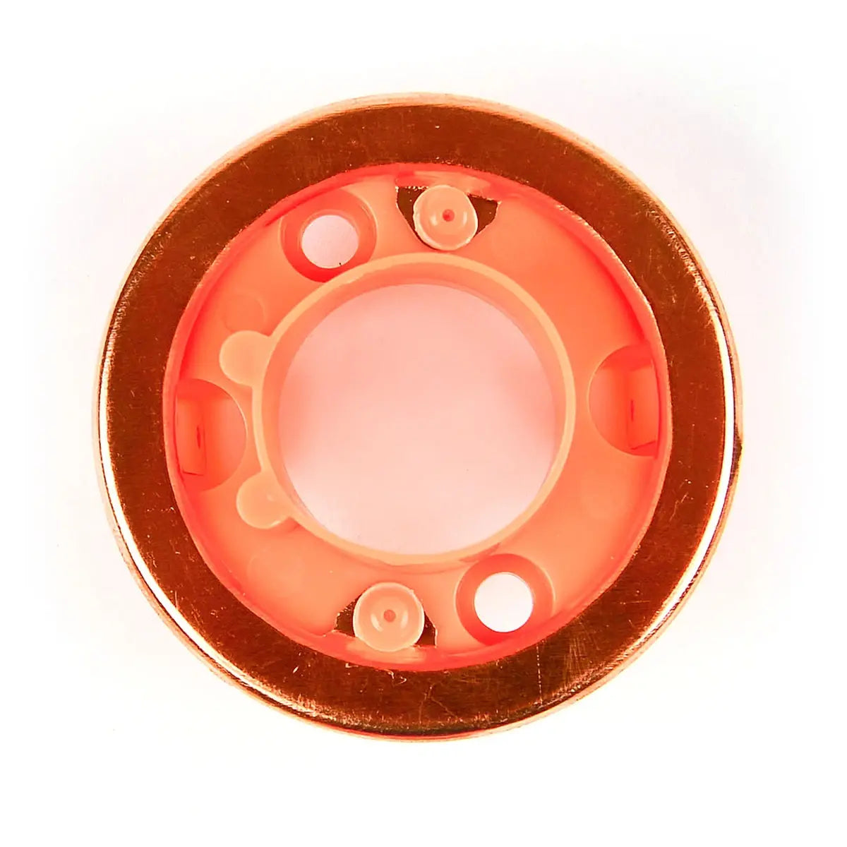 Close-up of a circular object with a red glow on a white background