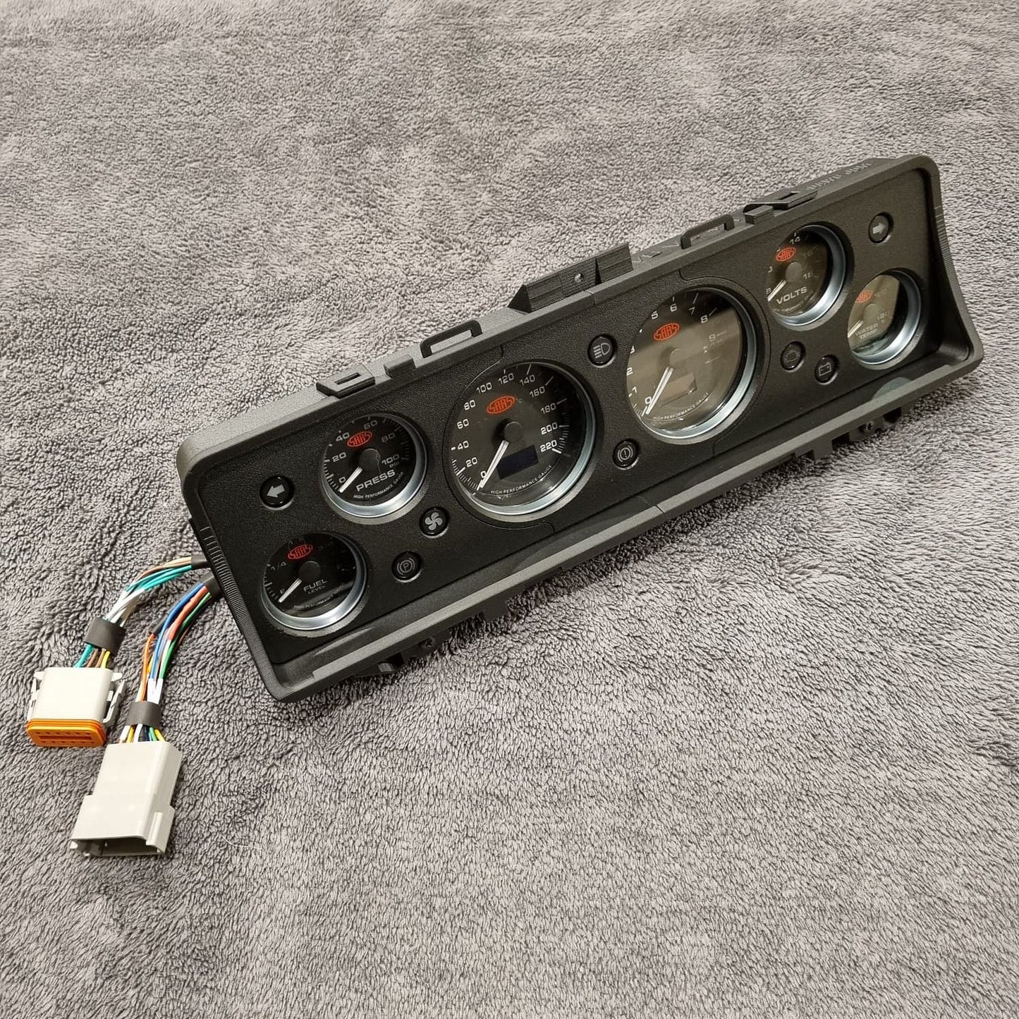Instrument Cluster Replacement panel with gauges and wiring on a gray surface