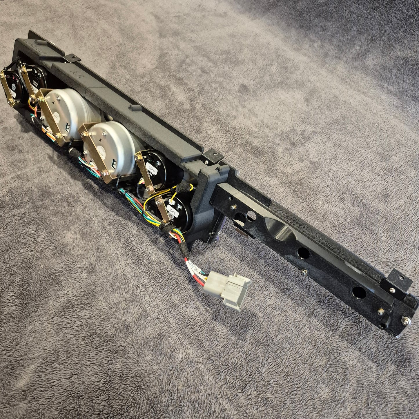 Mechanical arm or robot limb on a gray surface