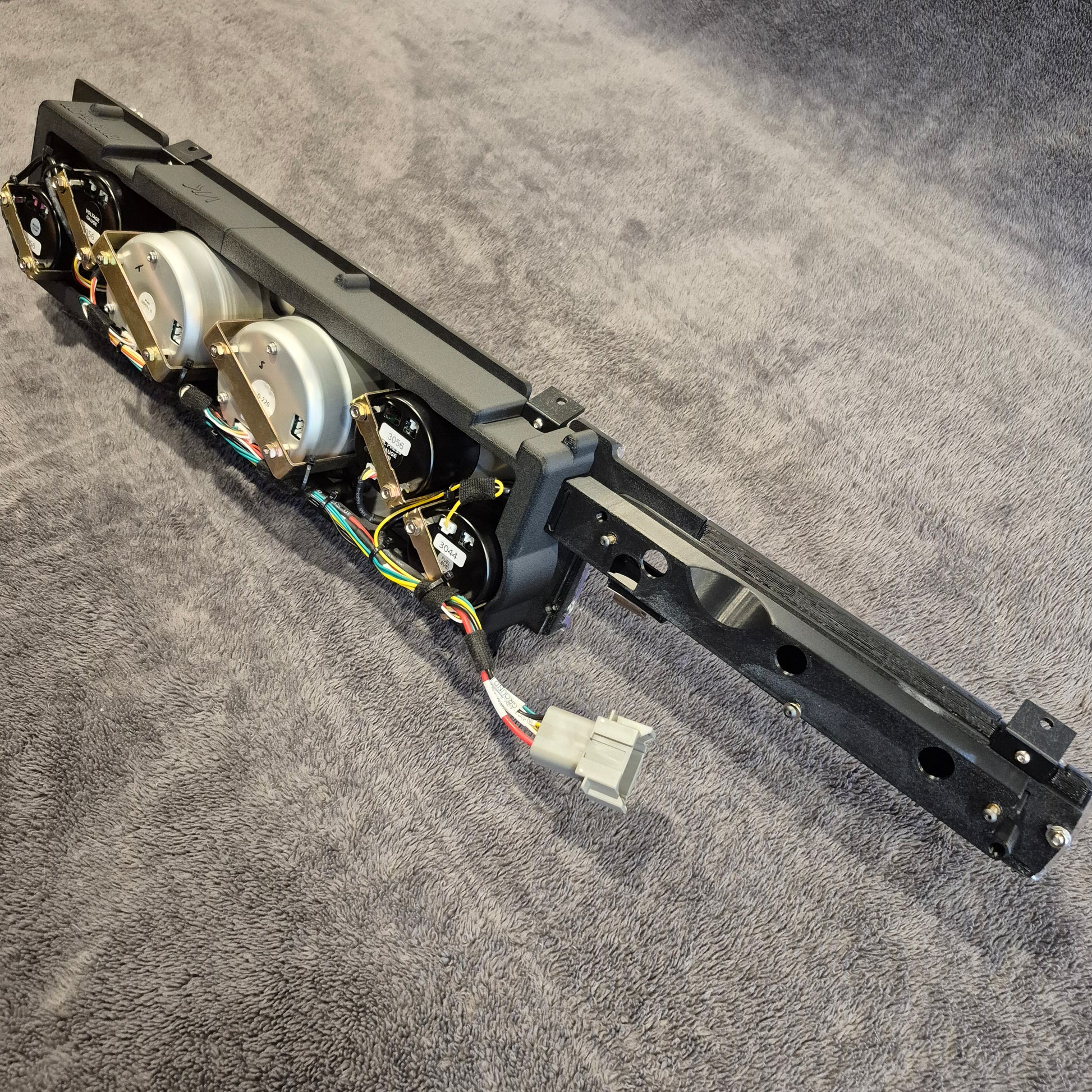 Mechanical arm or robot limb on a gray surface