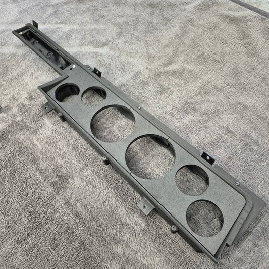 Car dash with multiple holes on a textured surface