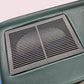 Black textured mat on a green surface