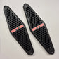 A pair of black honeycomb-patterned protective covers with red 'GTS' lettering, displayed on a light gray background.