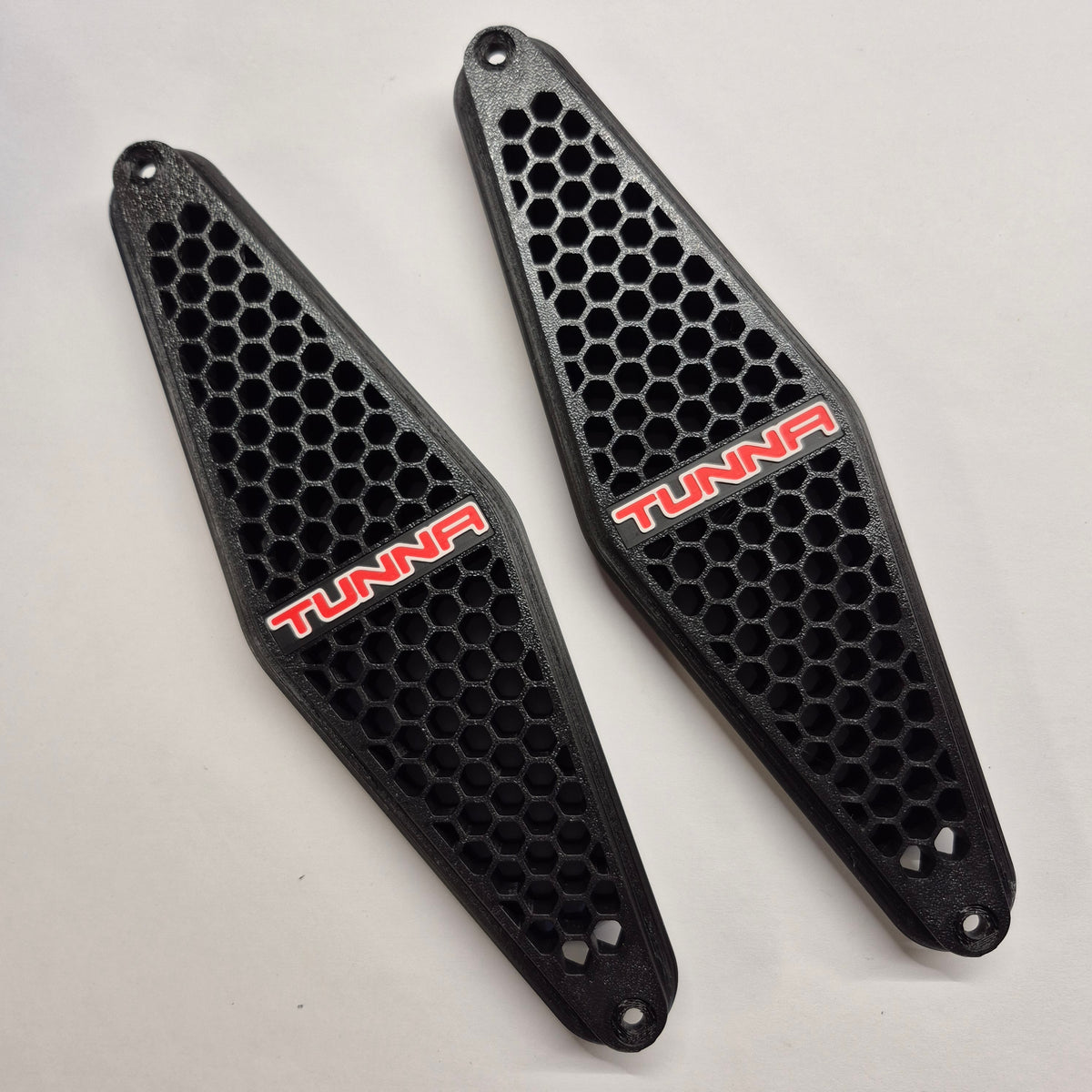 HQ–WB Holden One Tonner Tunna GTS style side vents, black honeycomb with red and white TUNNA badge – pair shown at an angle