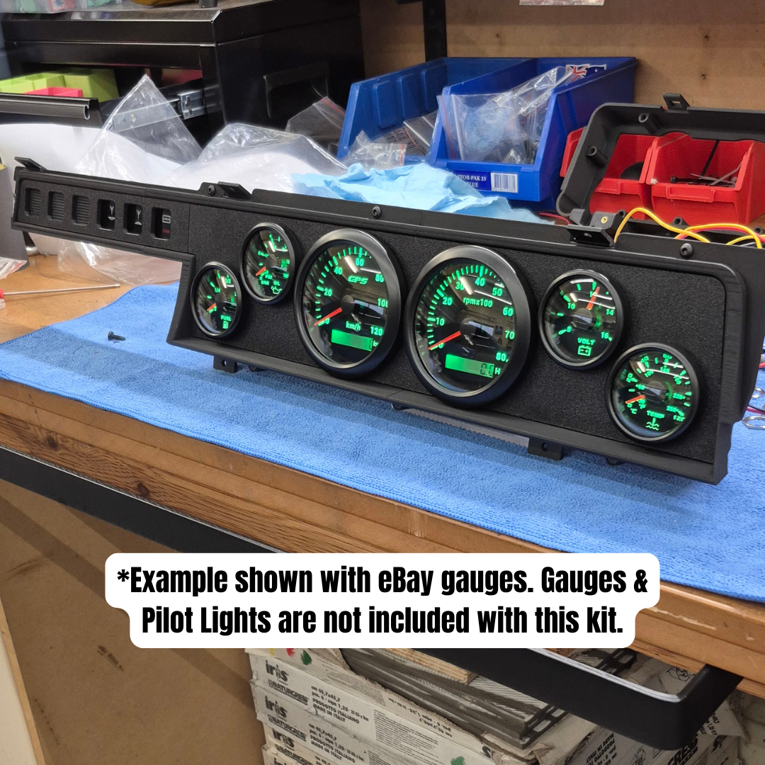 Car dashboard gauge cluster on a workbench with text indicating included components.