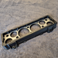 Engine cylinder head gasket on a textured gray surface