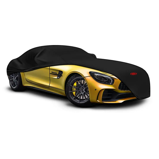 Black car cover on a yellow sports car with a white background