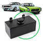 Black fuel tank with two classic cars in the background