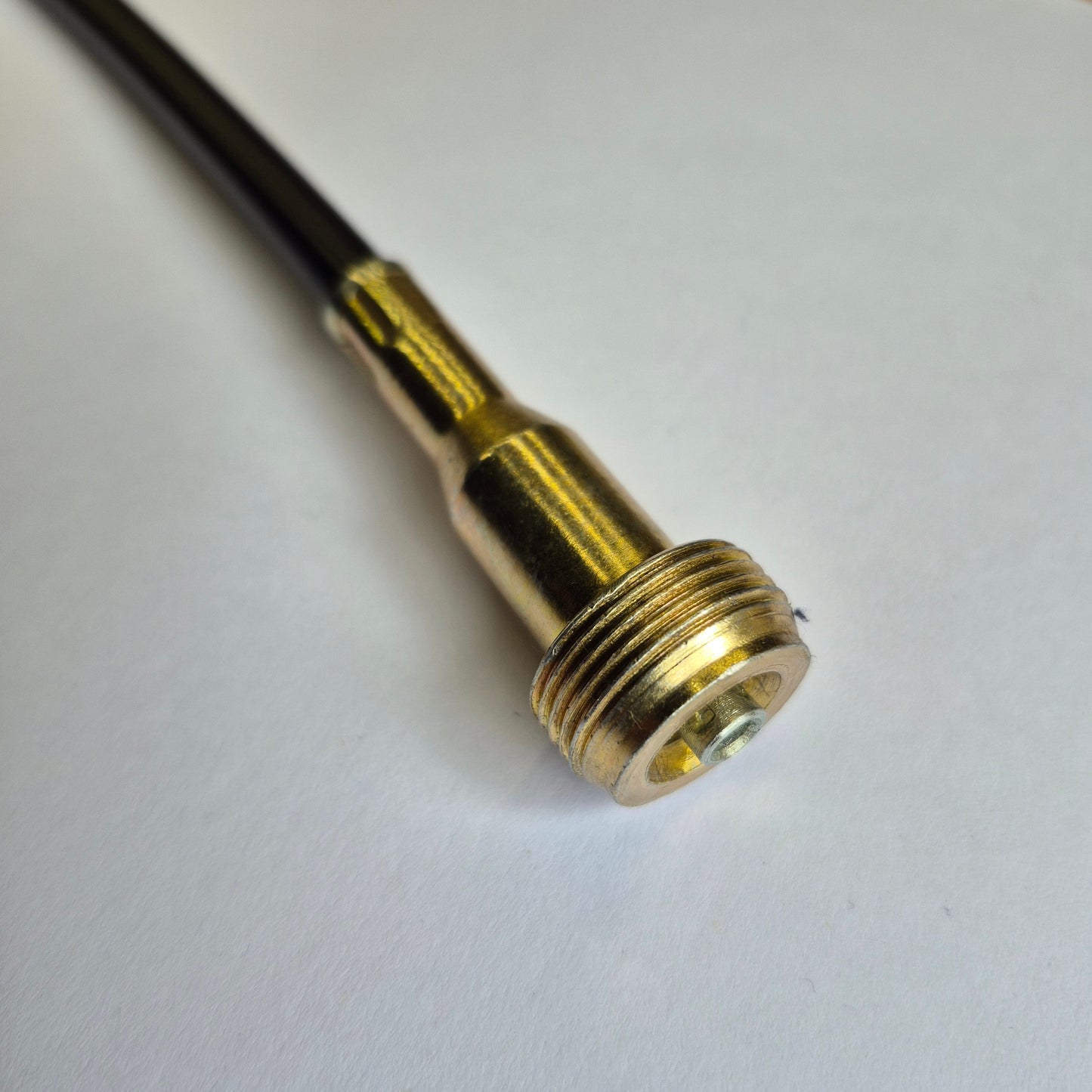 Gold-colored metal fitting on a white background