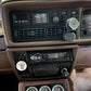 Car dashboard with vintage radio and gauges