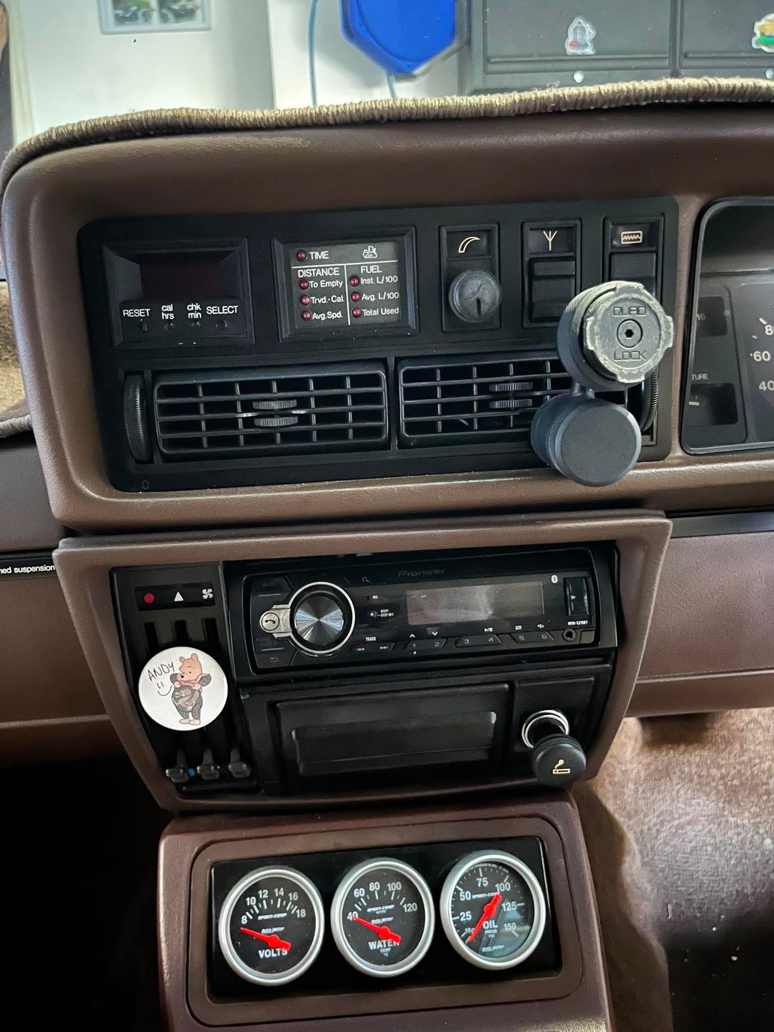 Car dashboard with vintage radio and gauges