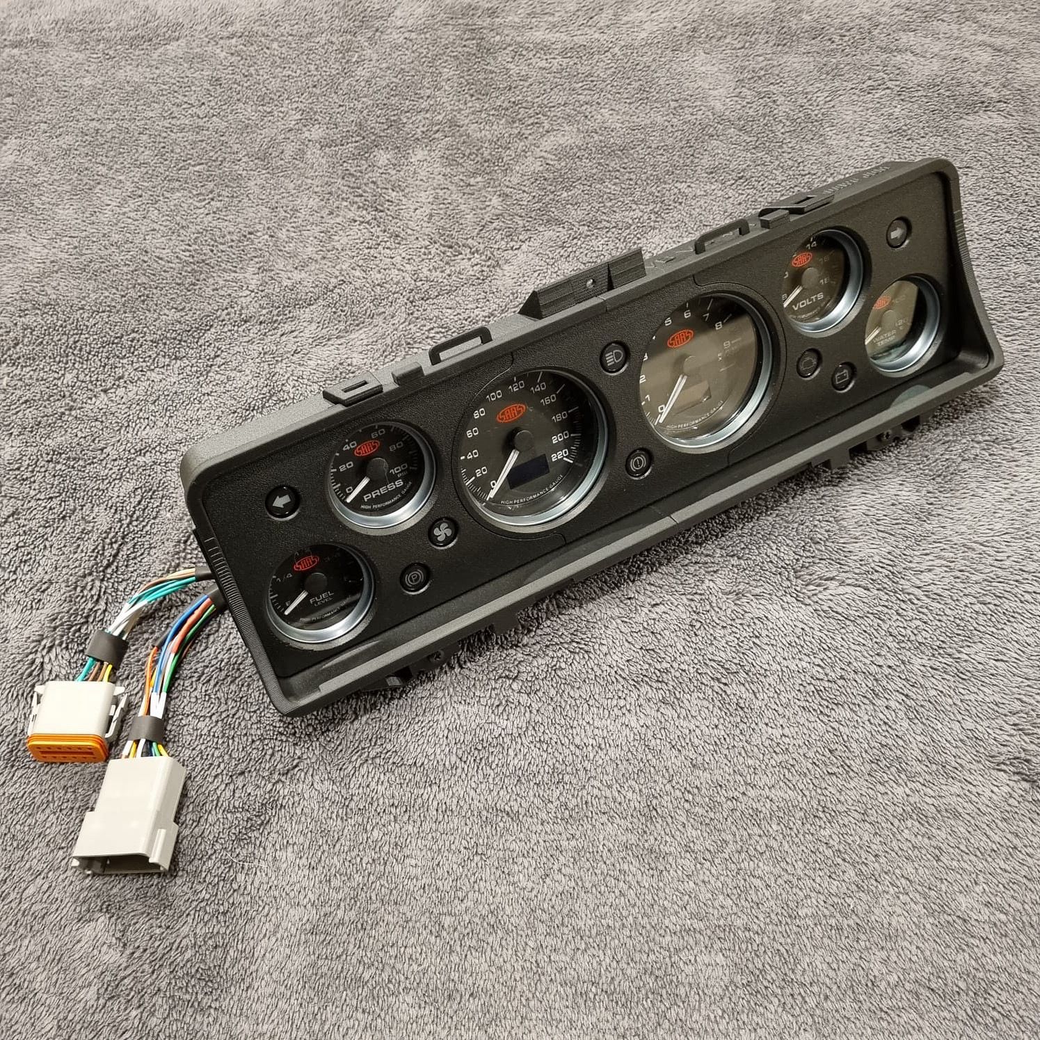 Instrument Cluster Replacement panel with gauges and wiring on a gray surface