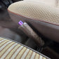 3D printed handbrake button in purple fitted to the brown handbrake lever of a Toyota LandCruiser 60 Series