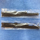 Back of genuine Toyota 75370-60020 LandCruiser 60 Series emblems showing black base and factory mounting pins